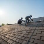 Roofing professionals installing durable shingles during a roof replacement in Prescott, AZ