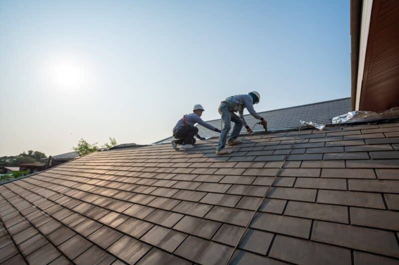 Roofing professionals installing durable shingles during a roof replacement in Prescott, AZ