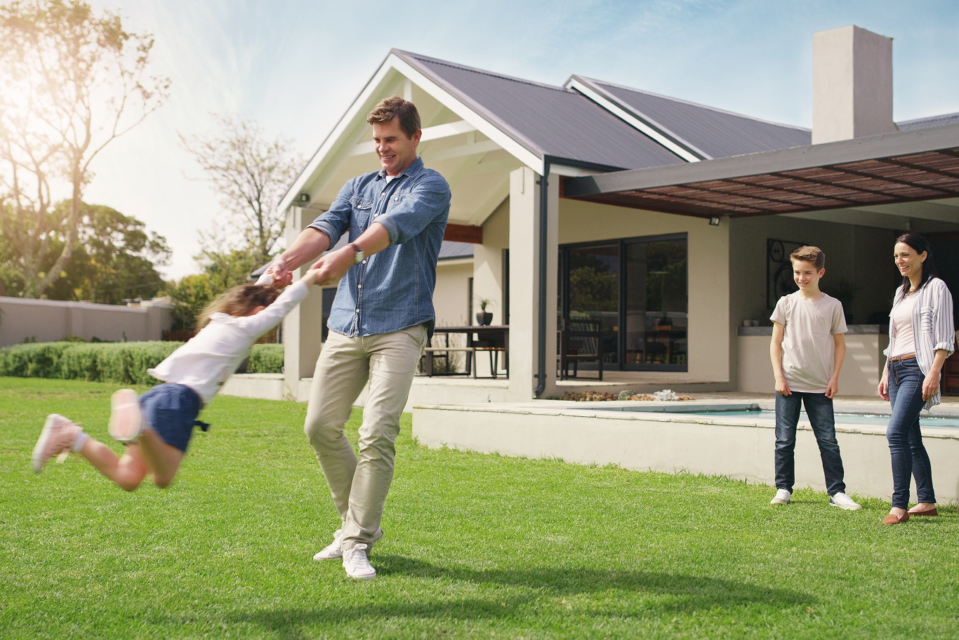 Family enjoying a secure home with a well-maintained roof