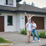 Family outside home after emergency roof repair in Prescott